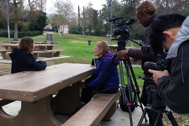 UCLA professor Ursula Heise, at right, interviews Karen Mabb, U.S. Navy biologist, about the Green-cheeked parrot.