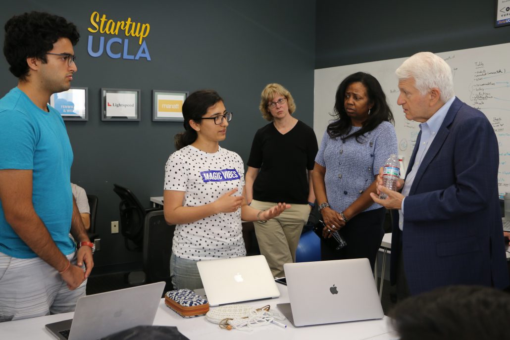 Chancellor Block speaks with accelerator students Bhupendra Chaudhary and Sonali Galhotra MBA ‘18
