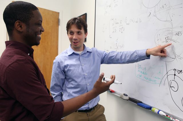 Photo of Postdoctoral scientist Adeyemi Adebiyi and Jasper Kok, associate professor of atmospheric and oceanic sciences.