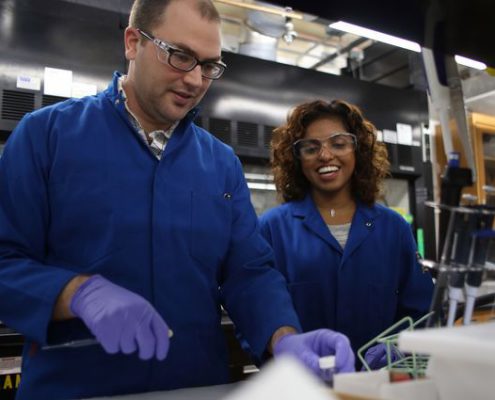 Photo of Justin Caram, assistant professor of chemistry and biochemistry in the UCLA College, and graduate student Dayanni Bhagwandin.