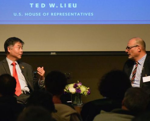 U.S. Rep. Ted Lieu speaks with UCLA professor Abel Valenzuela during an audience Q&A following the Winston C. Doby lecture.