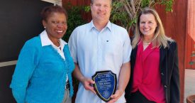 Coretta Harris, left, chair of the 2019 Gold Shield Faculty Prize Committee; Paul Barber; and Karen Sears, ecology and evolutionary biology department chair, who nominated Barber for the award.