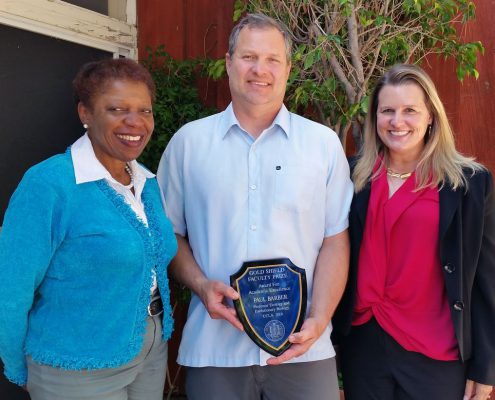 Coretta Harris, left, chair of the 2019 Gold Shield Faculty Prize Committee; Paul Barber; and Karen Sears, ecology and evolutionary biology department chair, who nominated Barber for the award.