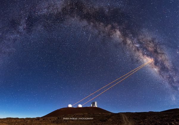 Photo of telescope pointing to the sky.