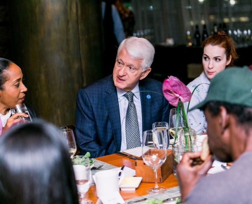 A photo of UCLA Chancellor Gene Block participating in a conversation.