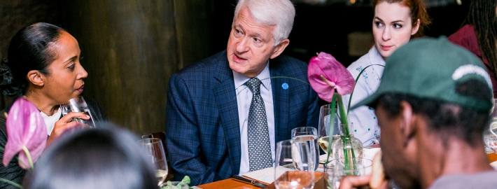 A photo of UCLA Chancellor Gene Block participating in a conversation.