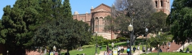 A photo of students on the UCLA campus, with the Janss Steps and Royce Hall in the background.