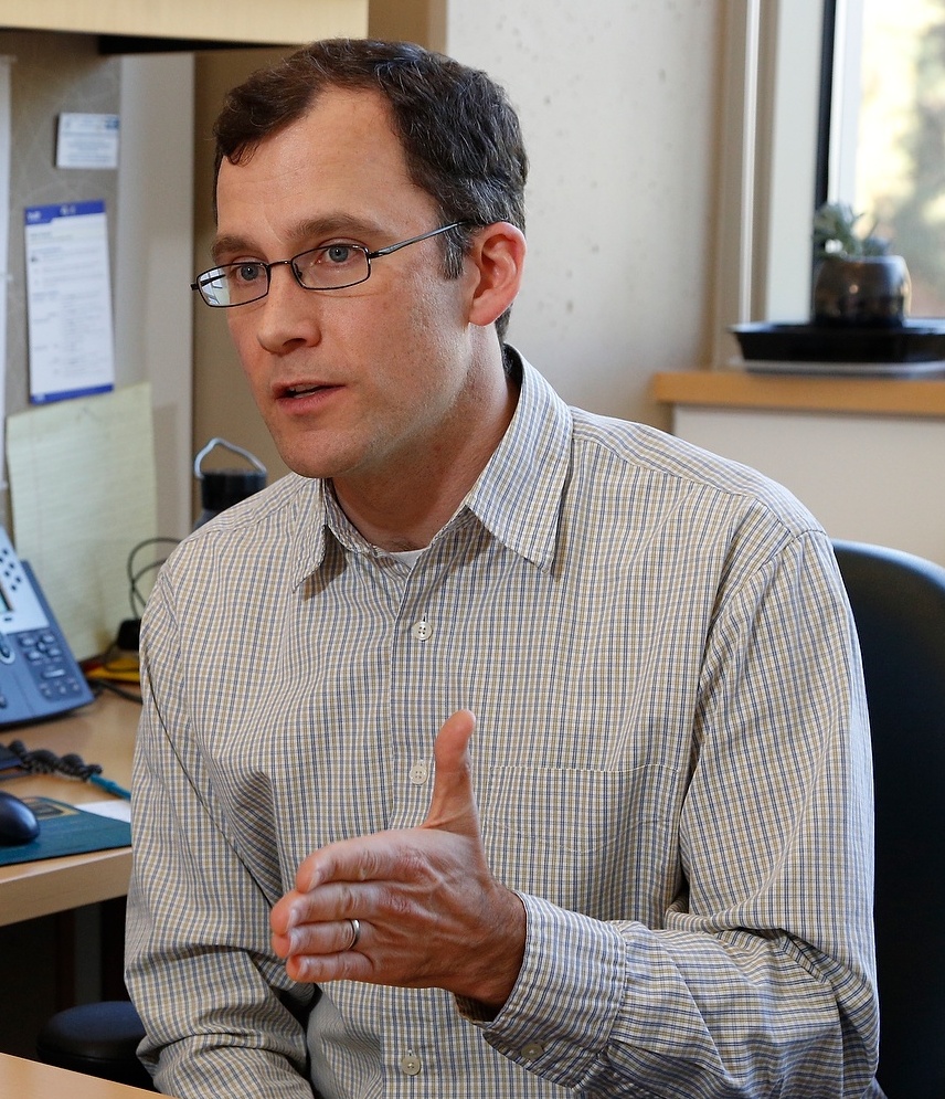 A photo of James Lloyd-Smith in his office. 