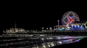 A photo of the Santa Monica Pier at night.