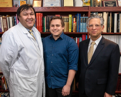 A photo of Dr. Steven Jonas, Jason Belling and Paul Weiss of UCLA .