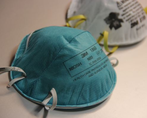 A photo of two N95 respirators.