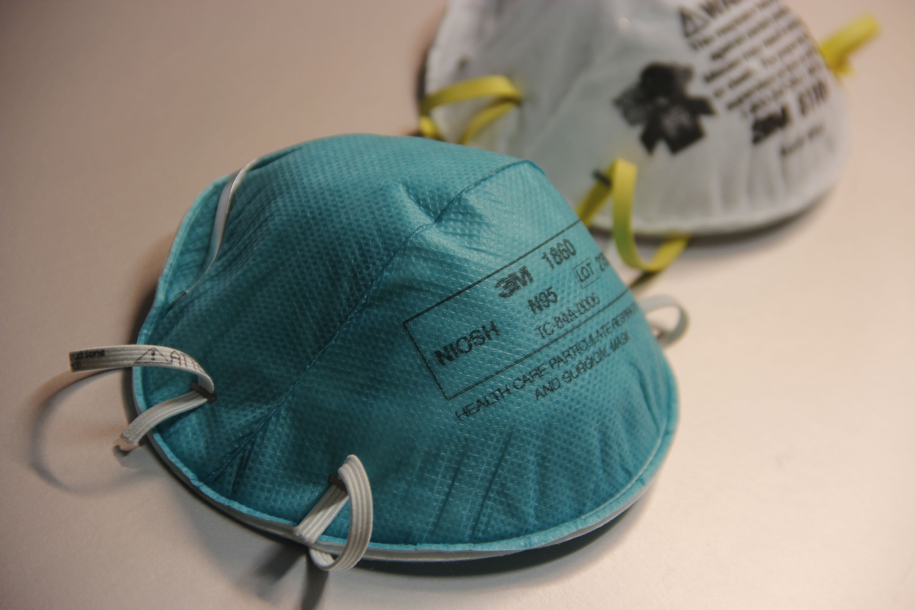 A photo of two N95 respirators.