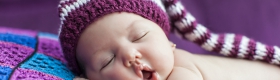 A photo of a sleeping baby.
