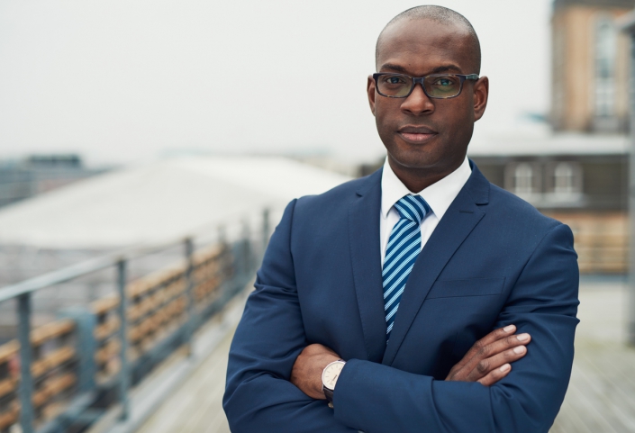 Confident black business man A photo of a Black man in suit and tie.