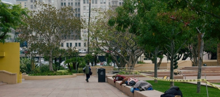 A photo of people sleeping at Pershing Square in downtown Los Angeles