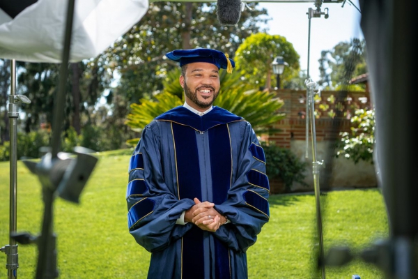 A photo of D’Artagnan Scorza filming his address to the UCLA College’s class of 2021.
