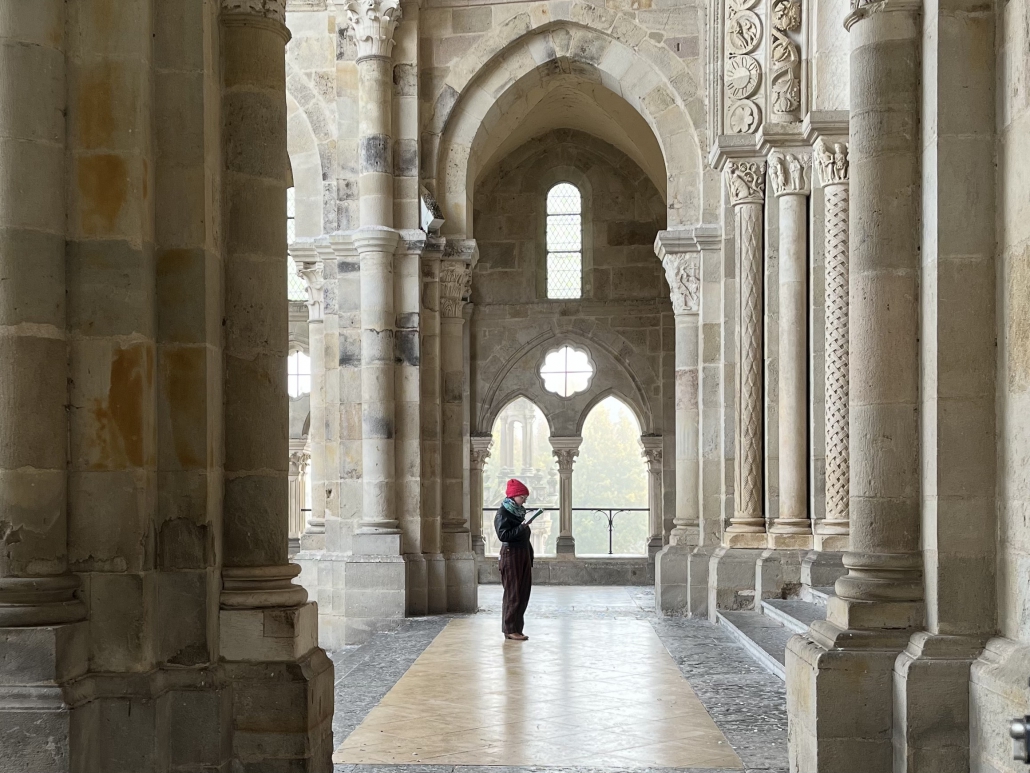 Photo of Tori Schmitt visiting Autun Cathedral in France.