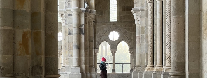 Photo of Tori Schmitt visiting Autun Cathedral in France.