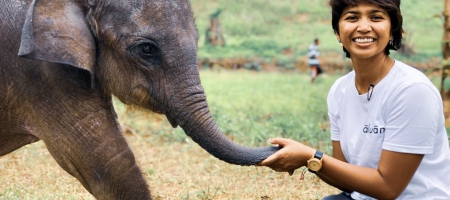Image of Farwiza Farhan with baby elephant