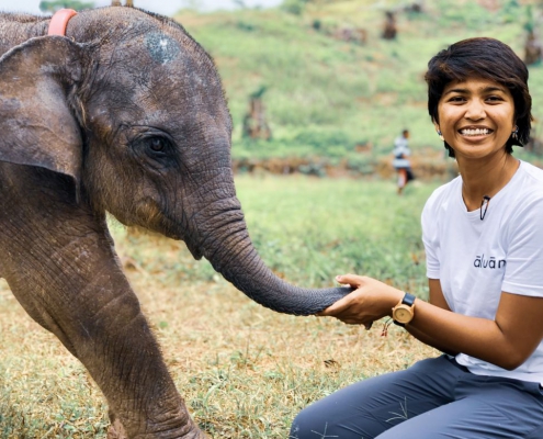 Image of Farwiza Farhan with baby elephant