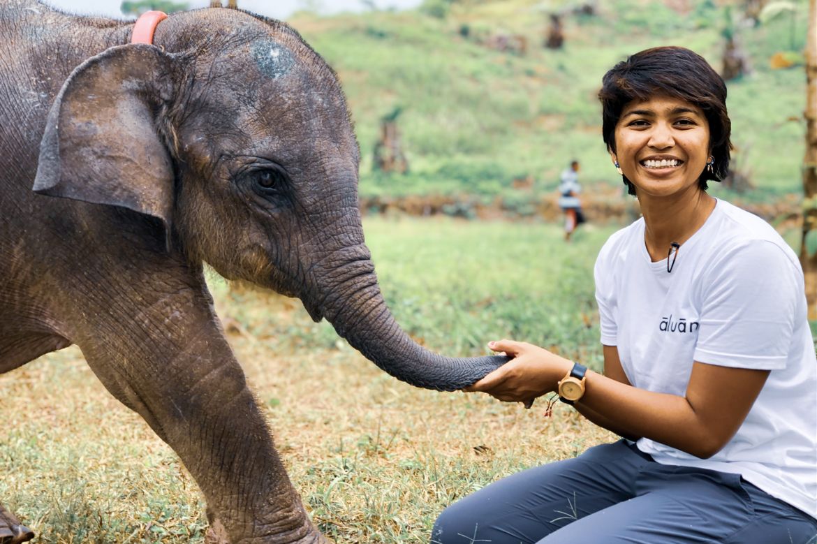 Image of Farwiza Farhan with baby elephant