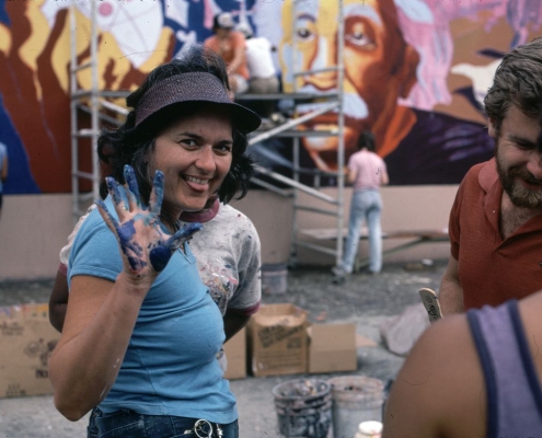 An image of Judy Baca at “The Great Wall of Los Angeles” in the summer of 1983.