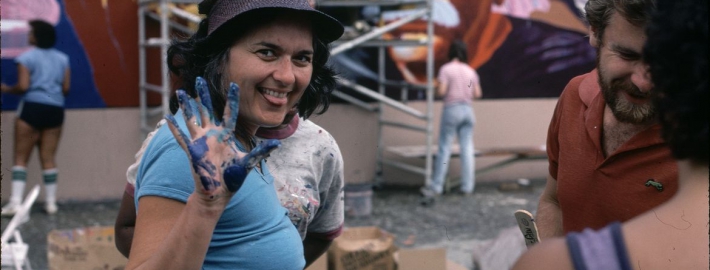 An image of Judy Baca at “The Great Wall of Los Angeles” in the summer of 1983.