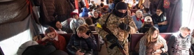 Image of people in the evacuation train at the railway station in Kyiv