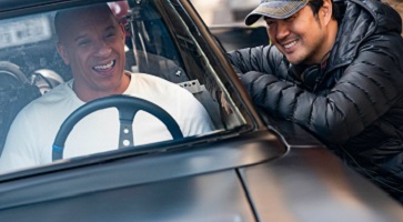 Image of actor Vin Diesel with director Justin Lin on the set of “F9: The Fast Saga.”