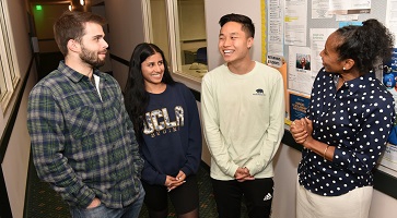 Image of Angela Deaver Campbell with three 2019 graduates who benefited from the Scholarship Resource Center’s support, Wesley Armstrong, Sereena Nand and Austin Lee.