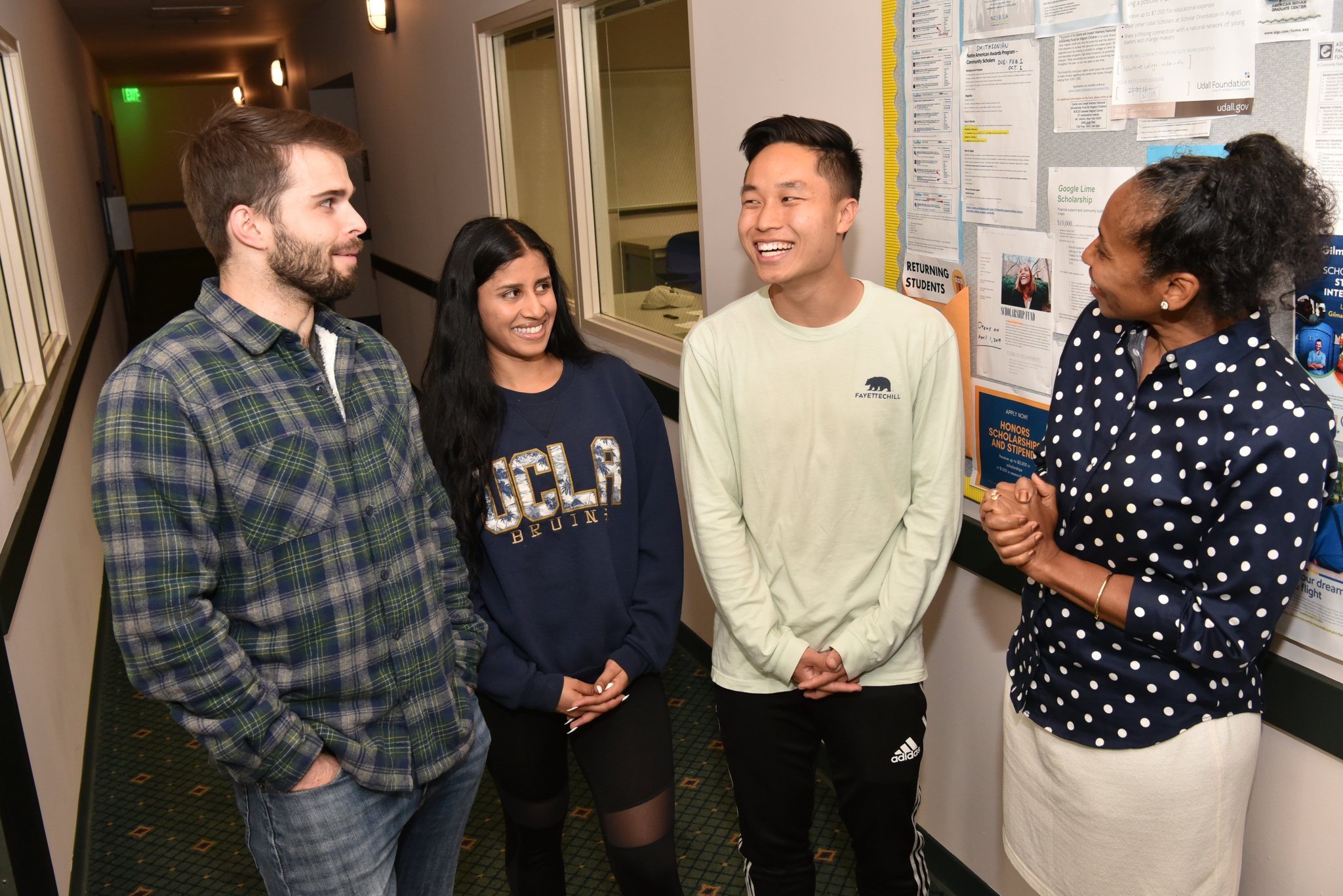 Image of Angela Deaver Campbell with three 2019 graduates who benefited from the Scholarship Resource Center’s support, Wesley Armstrong, Sereena Nand and Austin Lee.