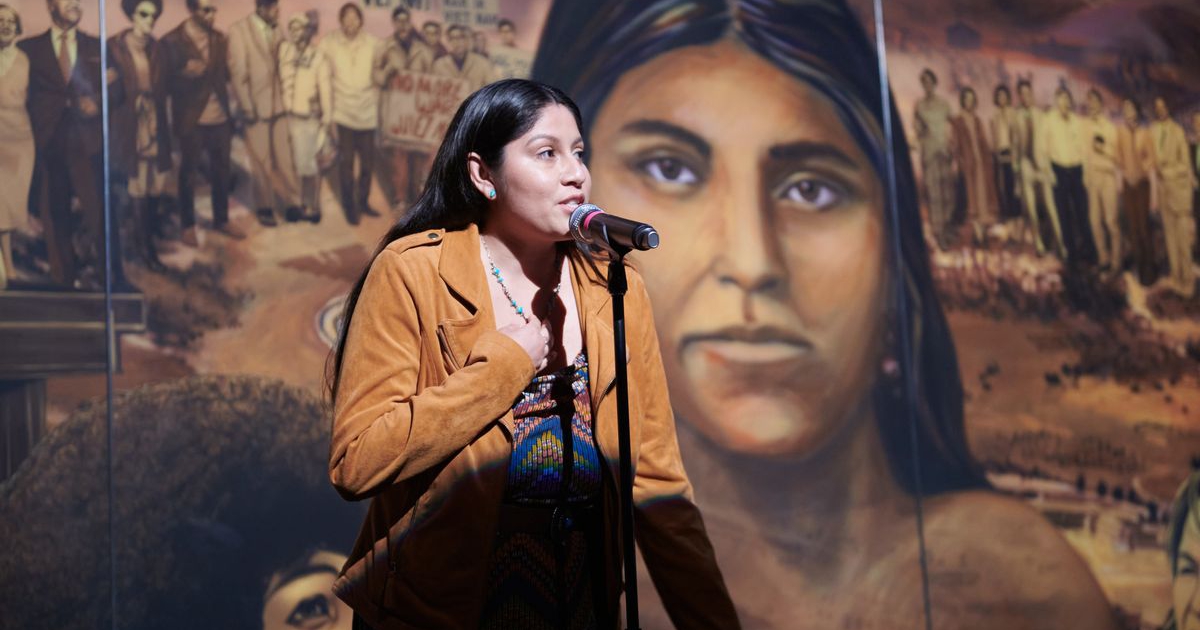 Image of Desirae Barragan, who is a registered member of the Gabrieleño Band of Mission Indians, Kizh Nation, at the unveiling of the mural “La Memoria de la Tierra: UCLA.”