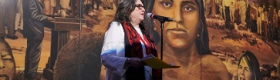 Image of Judith Baca, UCLA professor emeritus of Chicana and Chicano and Central American studies and of world arts and cultures, at the unveiling of her mural “La Memoria de la Tierra: UCLA.” Image credit: Don Liebig/ASUCLA