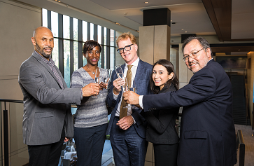 Image of the five UCLA College deans raising a toast.