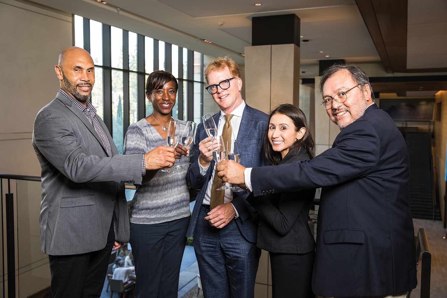 Image of the five UCLA College deans raising a toast.