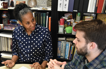 Image of Angela Deaver Campbell talking with a student.