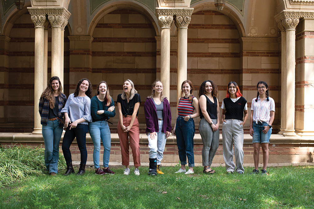 Portrait of nine members of the Society of Gender Equity in Geosciences at standing in front of Royce Hall