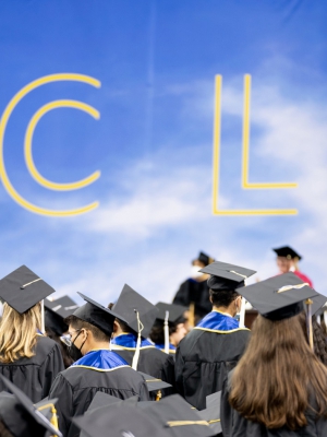 Commencement+2022+-+Crowd+and+UCLA+sign Image of students at UCLA commencement 2022 in Pauley Pavilion