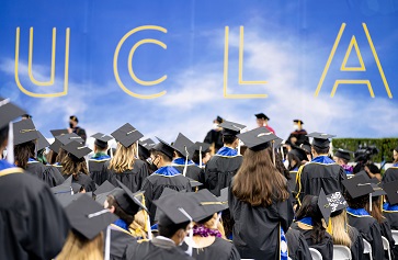 Image of UCLA students at commencement, beneath gold lettering reading "UCLA" on a blue background