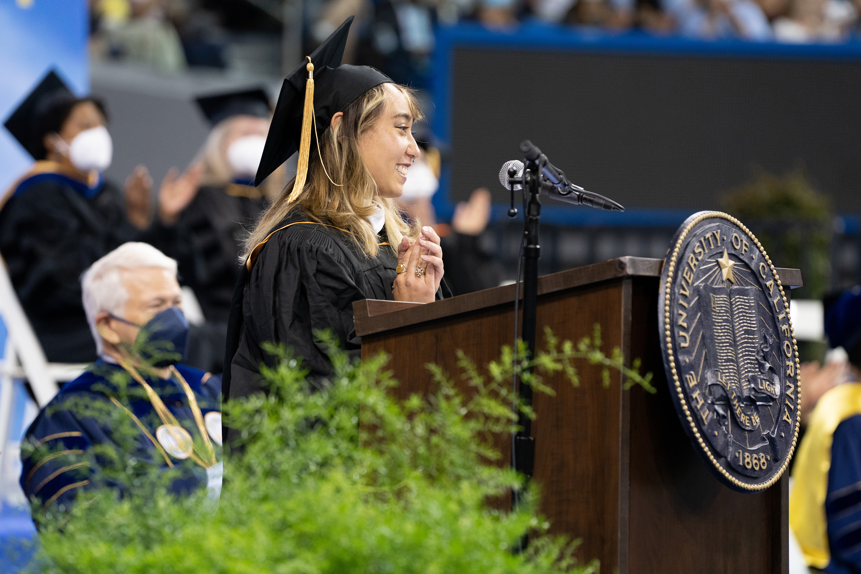 Image of Katelyn Ohashi speaking at UCLA College’s 2022 commencement in Pauley Pavilion. 