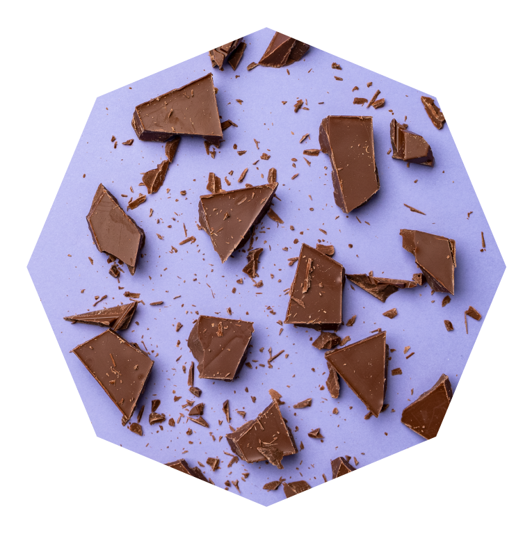 Image of pieces of chocolate on a purple background.