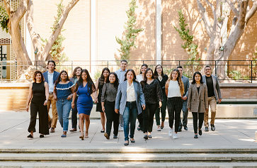 Wide shot of 16 LPPI staff, faculty and fellows of LPPI on campus