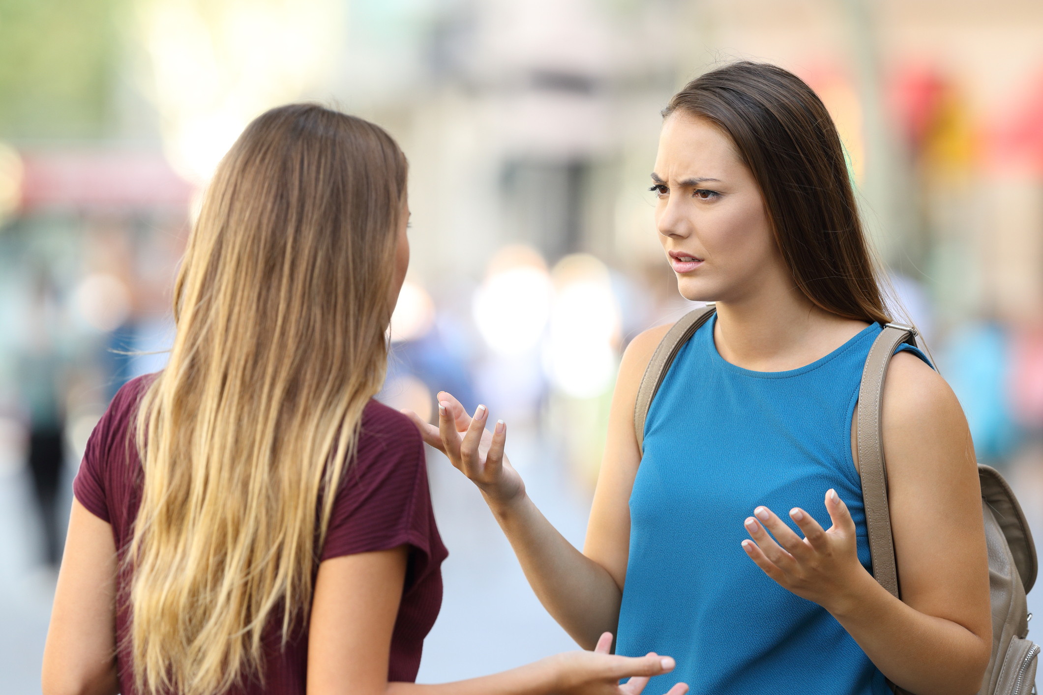 Image of Two women speaking to each other outdoors