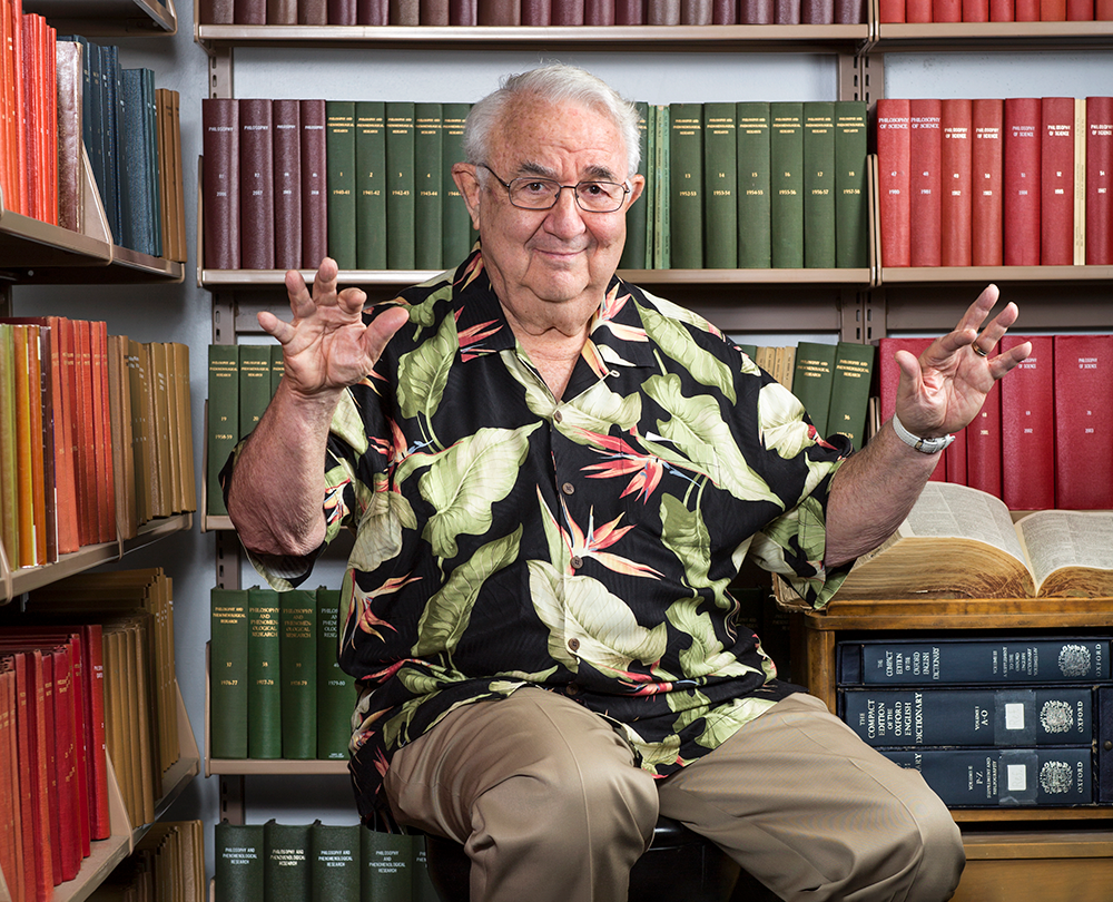 Image of Professor David Kaplan seated in front of a bookshelf.