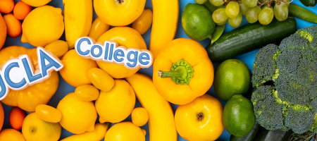 Image of colorful fruits and vegetables with the UCLA College logo spelled out in letters made of blue-and-white cookies