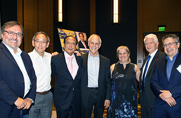 Group image of Miguel García-Garibay, dean of the UCLA Division of Physical Sciences; Steven Chu, Stanford’s William R. Kenan Jr. Professor of Physics and Professor of Molecular and Cellular Physiology, winner of the 1997 Nobel Prize in Physics and U.S. Secretary of Energy from 2009-2013; Mani L. Bhaumik, Institute founder, physicist and philanthropist; David Gross, UCSB’s Chancellor’s Chair Professor of Theoretical Physics at the Kavli Institute for Theoretical Physics and winner of the 2004 Nobel Prize in Physics; Andrea Ghez, UCLA's Lauren B. Leichtman & Arthur E. Levine Chair in Astrophysics and winner of the 2020 Nobel Prize in Physics; Gene D. Block, UCLA Chancellor; and Zvi Bern, director of the Mani L. Bhaumik Institute.