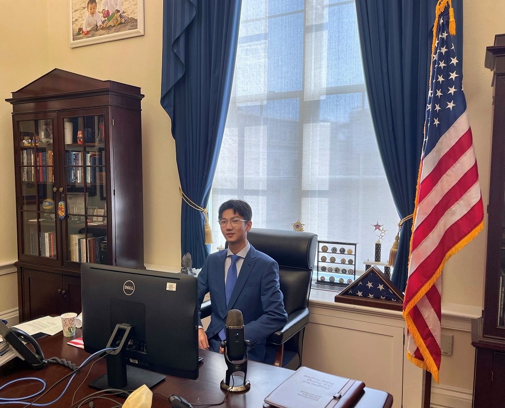 Image of UCLA student Bruce Fan sitting in an office in Washington, D.C., as part of his quarter in the nation’s capital