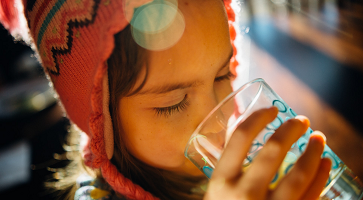 Image of a child drinking water