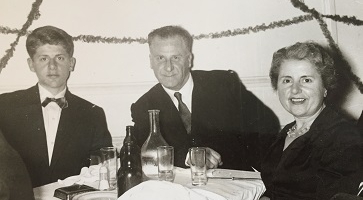 Image of three people sitting at a table
