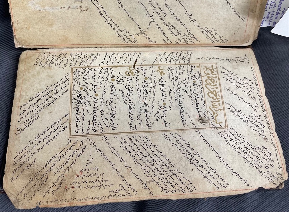 Image of Manuscript of religious commentary. In this image, al-Taftāzānī’s sharḥ (commentary) on al-Nasafī’s al-ʿAqāʾid al-Nasafīyya (the creed of an-Nasafī) can be seen within the textblock. In the marginalia and between the text, glosses on this commentary and intertextual references by several different scholars can be found. 